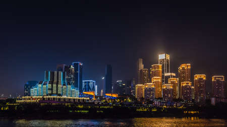 Chongqing, China -  August 2019 : Night view of the Chongqing city lights over Jialing and Yangtze river with illuminated skyscrapers in the backgroundのeditorial素材
