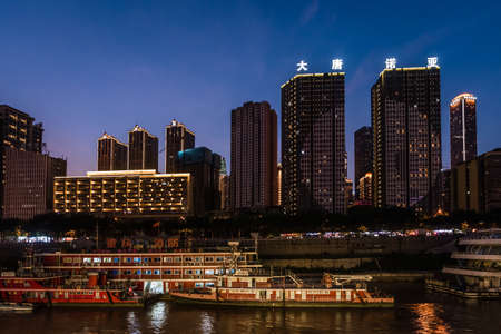 Chongqing, China -  August 2019 : Night view of the Chongqing city lights over Jialing and Yangtze...