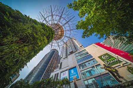 Chongqing, China -  August 2019 : Modern commercial and business skyscraper buildings containing huge shopping centre inside, the Jiefangbei districtのeditorial素材