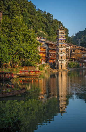 Feng Huang, China -  August 2019 : Landmark Fenghuang Wanming Pagoda Tower on the riverbank of Tuo river, flowing through the centre of Feng huang Old Townのeditorial素材