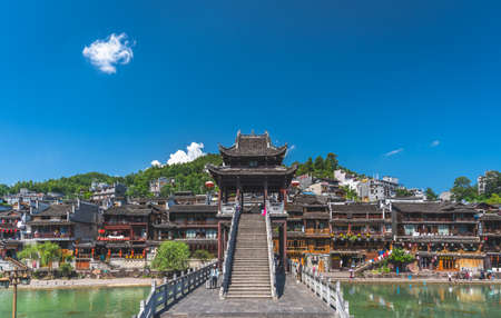 Feng Huang, China -  August 2019 : Steps and stairs to the lookout on top of scenic stone bridge over Tuojiang River Tuo Jiang River in ancient Old Town known as Phoenix Ancient Townのeditorial素材