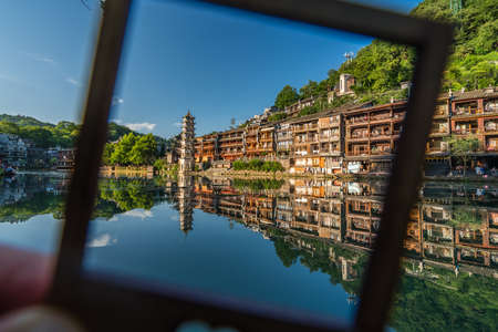 Feng Huang, China -  August 2019 : Framed Landmark Fenghuang Wanming Pagoda Tower and old heritage...