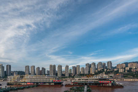 Chongqing, China - August 2019 : Luxury passengers cruise ships ready to depart from Chongqing wharf on a trip through the Three gorges on the Yangtze river in summerのeditorial素材