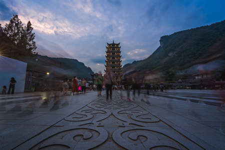 Zhangjiajie, China -  August 2019 : Crowds of people leaving the Wulingyuan exit to the Zhangjiajie national park in the evening, Hunan Provinceのeditorial素材