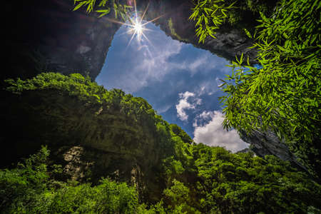 Stunning rocky arch fissure among mountain landscape of the Longshuixia Fissure National park, Wulong country, Chongqing, Chinaの写真素材