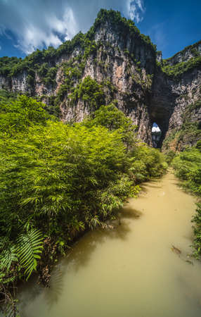 Small waterfall on a wall in a valley gorge in the Longshuixia Fissure National park, Wulong country, Chongqing, Chinaの写真素材