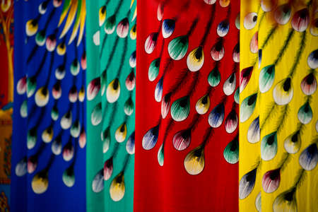 Colorful detail of ethnic minorities costume on display for sale in gift shop in Feng Huang, Hunan Province, Chinaの写真素材