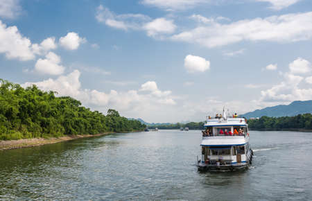 Yangshuo, China - August 2019 : Sightseeing boat full of tourists starting journey on a trip on the magnificent Li river from Guilin to Yangshuoのeditorial素材