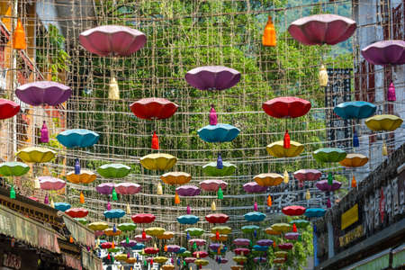 Yangshuo, China - August 2019 : A beautiful picture of Chinese lights and decoration against foliage mountainsのeditorial素材