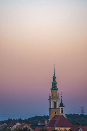 Swiebodzice, Poland - August 2020 : Åwiebodzice church tower above the City Hall building photographed at sunsetのeditorial素材