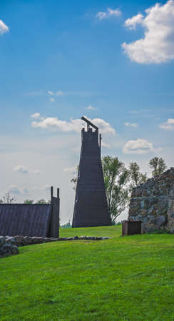 A low angle shot of reconstructed ancient wooden tower used in attacking medieval castles during a siegeのeditorial素材