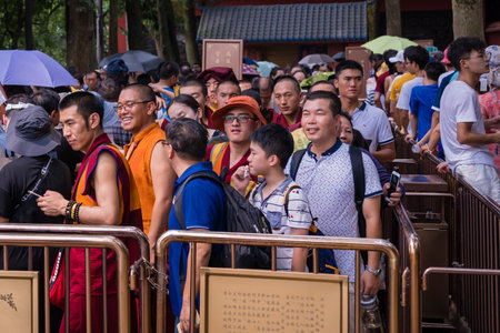 Leshan, China - July 2019 : Massive tourist crowds in a extremely long queue to the Leshan Buddha plank walk, Sichuan Provinceのeditorial素材