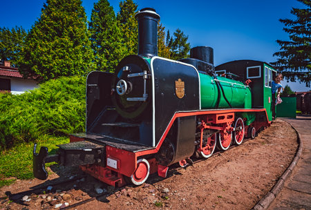 Wenecja, Poland - July 2020 : Girl inside the old disused narrow gauge train locomotive in the museumのeditorial素材