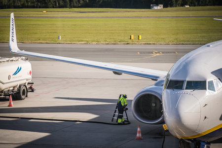 Wroclaw, Poland - August 2020 : Technician looking at the engine of Ryanair plane at Wroclaw airportのeditorial素材