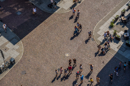 Torun, Poland - August 2020 : View of the people walking on the historical Cobblestoned streets in Torun Old town in summer, picture taken from high above viewing platform in the Ratusz Clock towerのeditorial素材