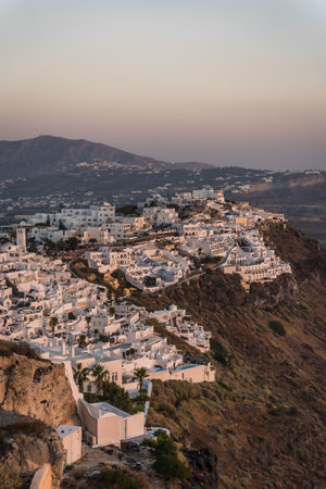 Cliffside homes of Fira  at sunset in summer, Santorini Island,Greeceの写真素材