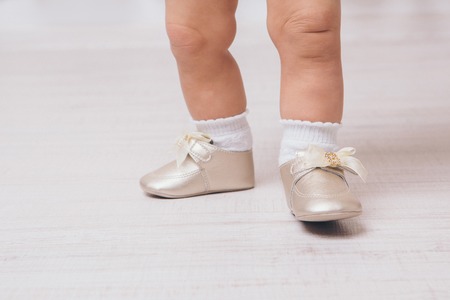 feet of a baby in pointe shoes, close-upの写真素材