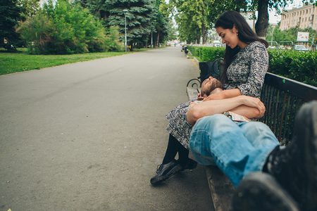 the guy lies at the girl on his kneesの写真素材