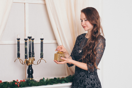 girl opens a giftの写真素材