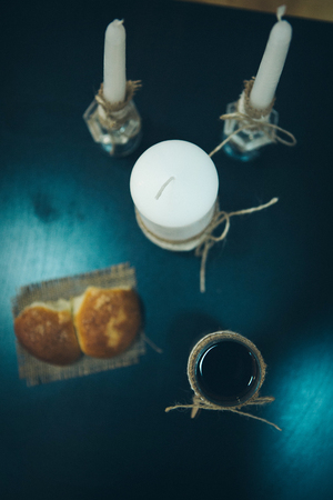 Religious rite: communion. candles, wine, bread. Top viewの写真素材