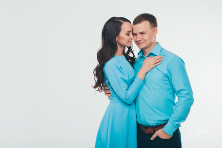 portrait of a man and a woman on a white background. Pair in blueの写真素材