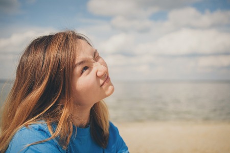 Portrait of woman on a sea backgroundの写真素材