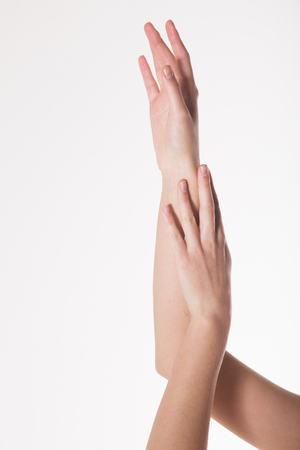 two women's hands on a white background. Empty hand isolated on whiteの写真素材
