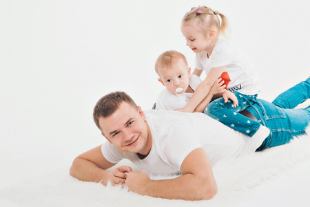 family portrait on the floor on white backgroundの写真素材