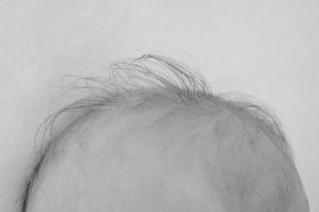 hair on the head of a newborn close-upの写真素材