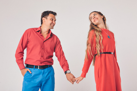 portrait of a man and a woman. Pair in redの写真素材