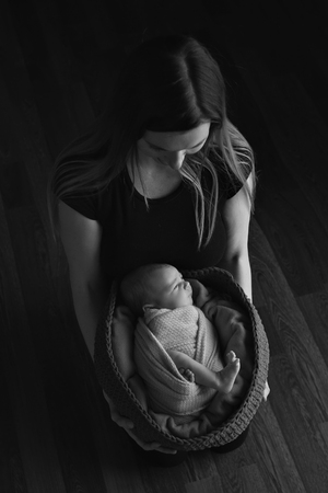 baby on the hands of mother. woman and childの写真素材