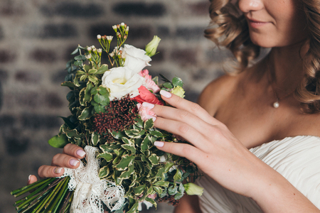 The bride holds the bouquet. Girl with flowersの写真素材