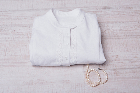 rolled up white shirt close up on white backgroundの写真素材
