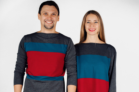 portrait of a man and a woman. Pair in red, grey and blueの写真素材