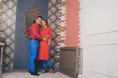 portrait of a man and a woman. Pair in redの写真素材