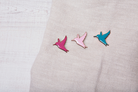 fabric texture as background. grey flax. Item of clothing close-up. bird a lightning strike.. Symbol on white backgroundの写真素材