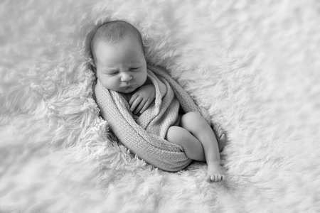 A little child in adiaper lies and sleepingの写真素材