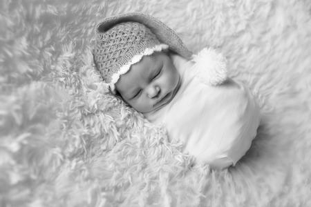 A little child in adiaper lies and sleepingの写真素材