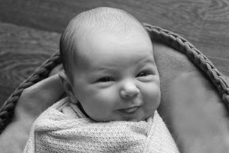 portrait of little child lies in black and white coloursの写真素材