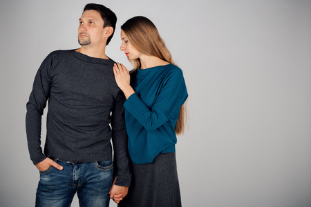 portrait: man and woman kissing on white background. Husband and wife face to faceの写真素材
