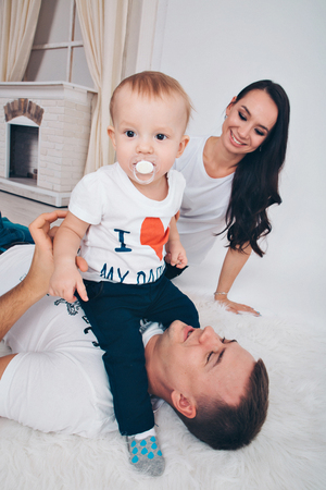 family portrait on the floor on white backgroundの写真素材