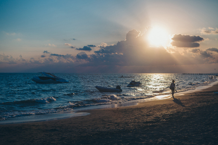 Beach view: sun, sea, sand, boatsの写真素材