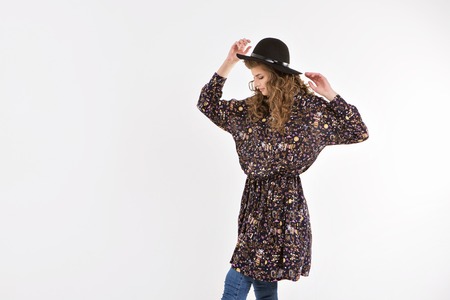 girl dancing in loose dress on white backgroundの写真素材