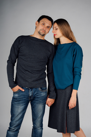 portrait: man and woman kissing on white background. Husband and wife face to faceの写真素材