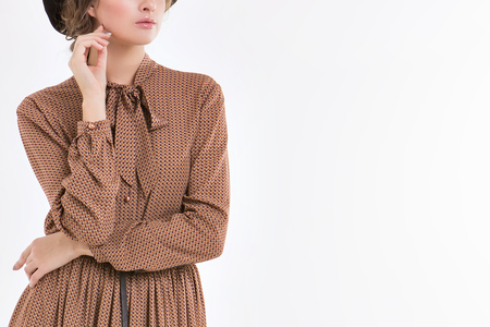 cropped photo: a girl holds the hand of a person. Model posing in a dress. Item of clothing close-upの写真素材