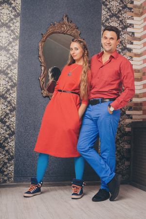portrait of a man and a woman. Pair in redの写真素材