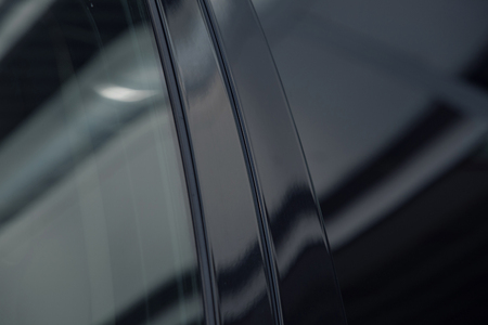 tinted black car Windows that reflect the glass ceiling