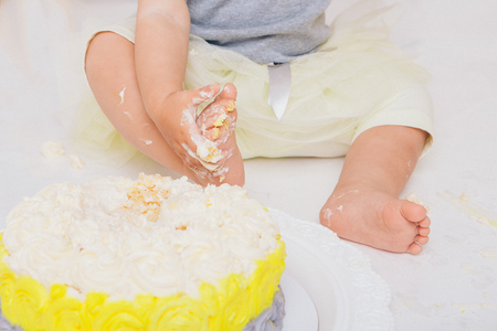 leg of baby food on white background. Feet and cakeの写真素材