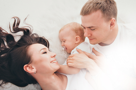 Family photo on the floor on a white backgroundの写真素材
