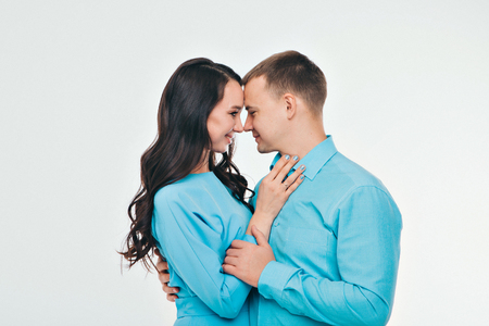 portrait of a man and a woman on a white background. Pair in blueの写真素材